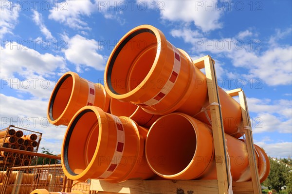 Stack of KG pipes on a construction site in the Mutterstadt development area, Rhineland-Palatinate