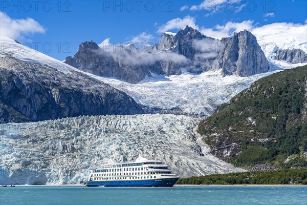 Cruise ship Stella Australis anchors in front of the Pia Glacier, Alberto de Agostini National Park, Avenue of the Glaciers, Chilean Arctic, Patagonia, Chile, South America