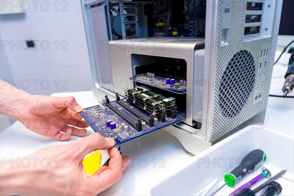 Close-up of an unrecognizable engineer technician working with electronic equipment in the lab