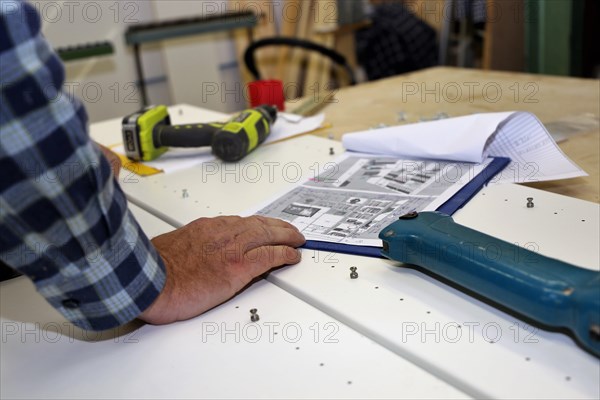 Carpenter at work in his carpentry workshop