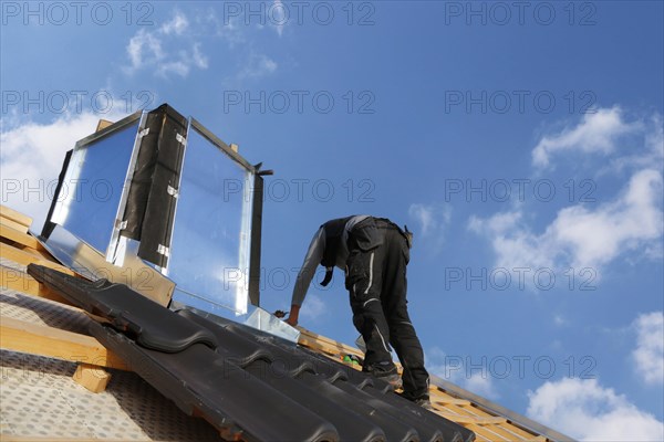 Carpenters working on the roof