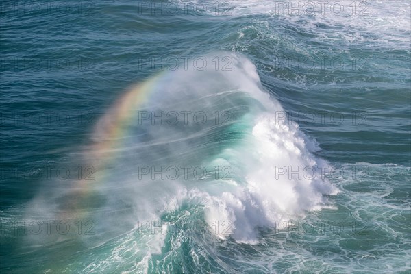 Spectral colours in the spray of a crashing wave, Nazare, Portugal, Europe