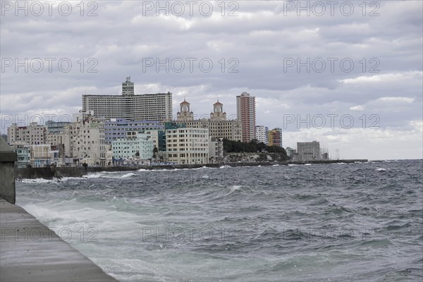 Malecon waterfront promenade with its faded splendour Stucco houses on the Malecon, Havana, Cuba, Central America