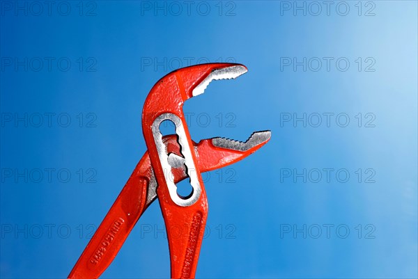 Open, opened red Tongue-and-groove pliers