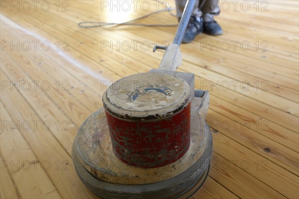 A parquet floor is sanded and oiled