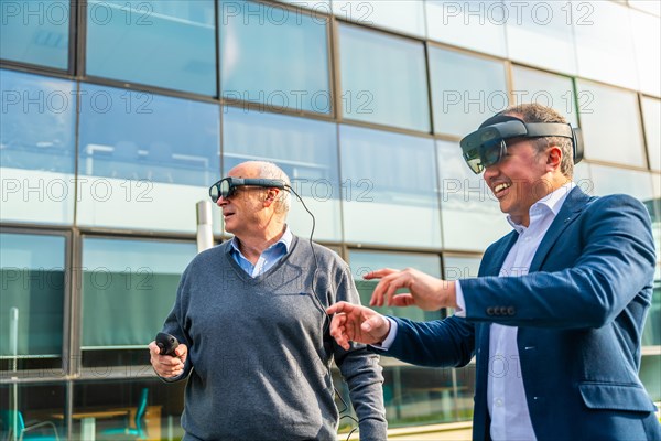 Senior and mature businessmen using the VR headset with actions outdoors next to a financial building
