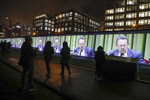 To mark the 30th anniversary of the fall of the Wall, 3D video projections of historical images and videos commemorate the events of the Peaceful Revolution and the opening of the Wall at original locations, such as here at the East Side Gallery, Gueter Schabowski, Berlin, 6 November 2019