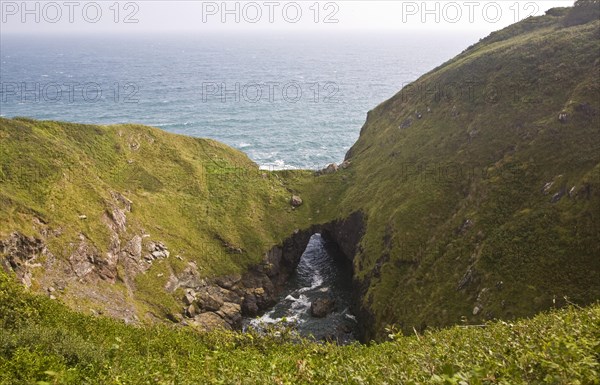 The Devil's Frying Pan coastal feature formed by the collapse and erosion of a large sea cave near Cadgwith on the Lizard Peninsula, Cornwall, England, United Kingdom, Europe