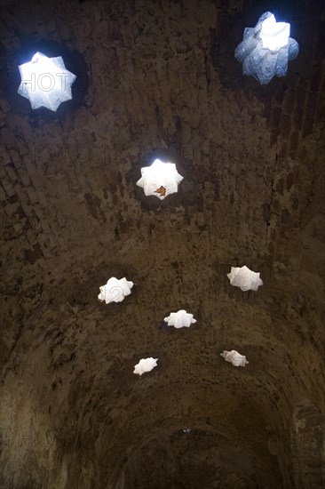 Star shaped skylights in vaulted roof of Arab Baths, Banos Arabes, Ronda, Spain, Europe