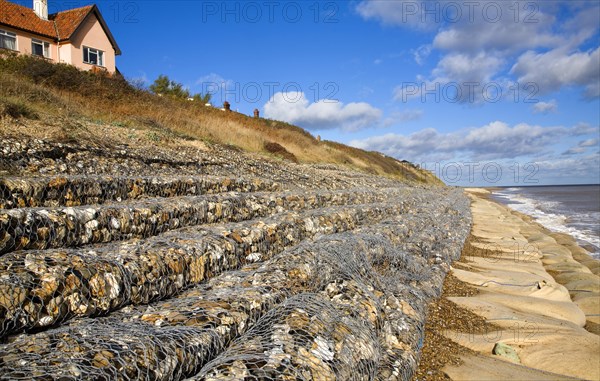 Coastal defences normally covered by shingle exposed by winter storms at Thorpeness, Suffolk, England in November 2013