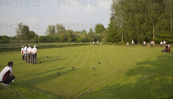 People playing bowls on bowling green at Clare, Suffolk, England, United Kingdom, Europe