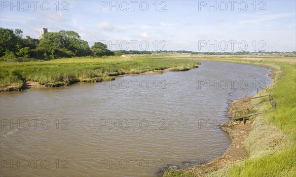 View upstream of levees and flood plain of tidal River Blyth, Blythburgh, Suffolk, England, United Kingdom, Europe