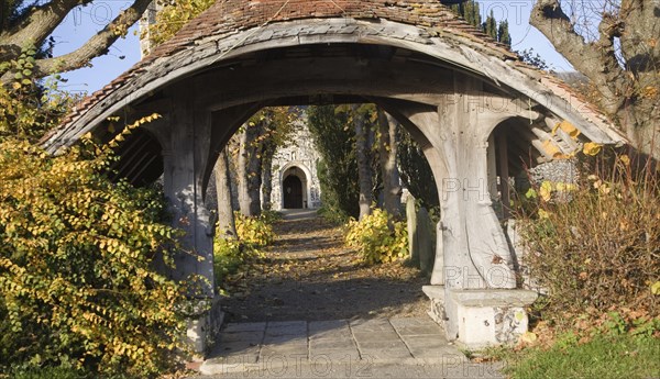 Historic wooden lychgate entrance to St Mary church, Kelsale, Suffolk England