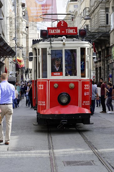 Historic tram Nostaljik Tramvay travelling through Istiklal Caddesi shopping street, Beyoglu, Istanbul, European part, Istanbul province, Turkey, Asia