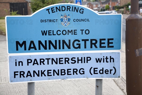 Road sign for the town of Manningtree, Tendring district council, Essex, England in partnership with Frankenberg Eder, Germany, Europe