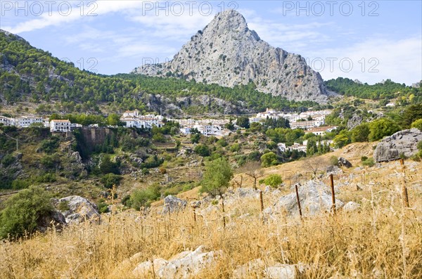 Limestone mountain peaks tower over the Village of Grazalema, Cadiz province, Spain, Europe