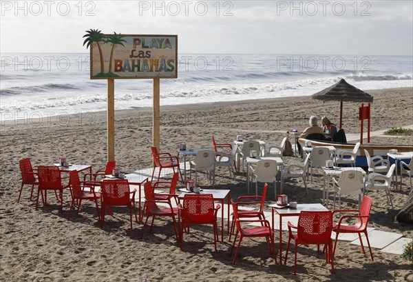 Two woman sitting on the beach in Torremolinos, in a restaurant, 13/02/2019
