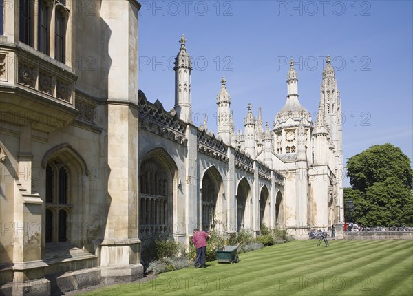 Gardener working outside King's College, University of Cambridge, England, United Kingdom, Europe