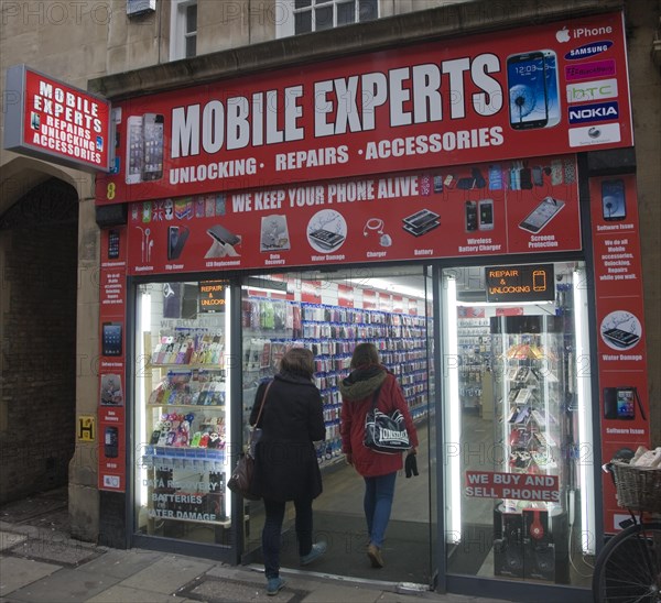 People entering Mobile Express shop in Cambridge city centre, England, United Kingdom, Europe