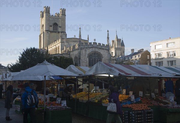 Historic tower of Great St Mary's church and market stalls in the city centre, Cambridge, England, United Kingdom, Europe