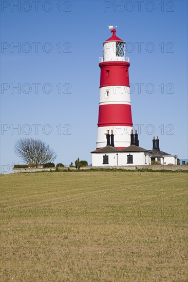 Red and white stripes of Happisburgh lighthouse, Norfolk, England, United Kingdom, Europe