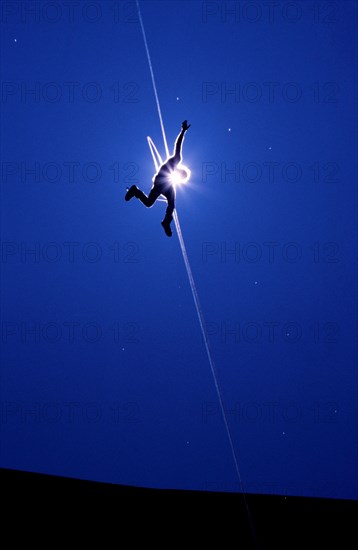 Man after jumping from Gemstalbruecke near Tannheim, Tyrol, Austria, vintage, retro, Europe