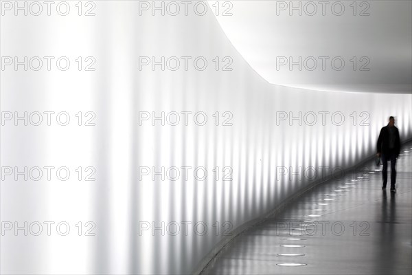 Members of the German Bundestag walk through a tunnel. The tunnel connects the Reichstag and the Paul Loebe Haus, Berlin, 13 November 2018