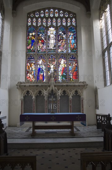 Stained glass window and altar inside Saint Mary parish church, Stoke by Nayland, Suffolk, England, UK