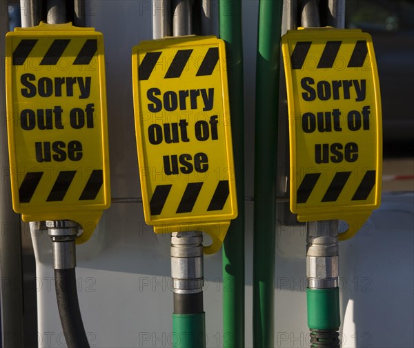 Petrol pumps with sign saying no fuel available