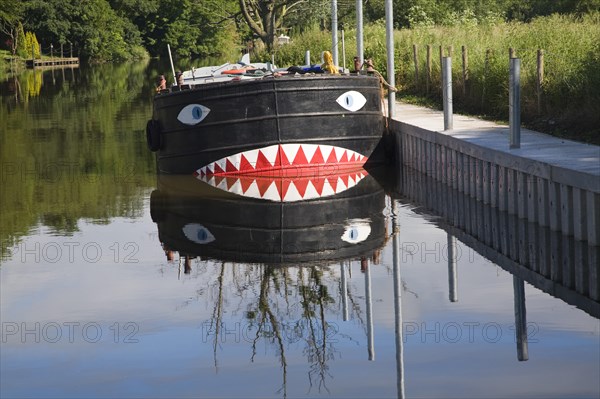 Boat on River Avon at Fladbury with a face painted on its bow, Worcestershire, England, United Kingdom, Europe