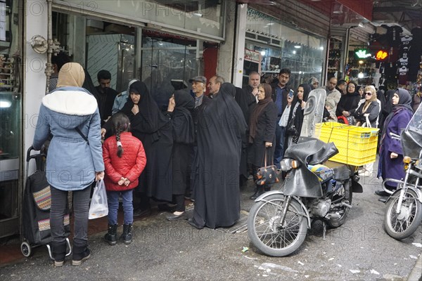 Shopping for the upcoming Persian New Year, queue in front of a butcher shop in a bazaar in Tehran, Iran, 18 March 2019, Asia