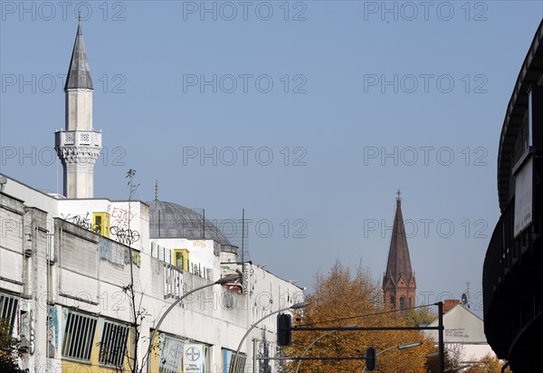 A church tower and the minaret of the Mevlana mosque in Berlin's Kreuzberg district, 12 October 2018