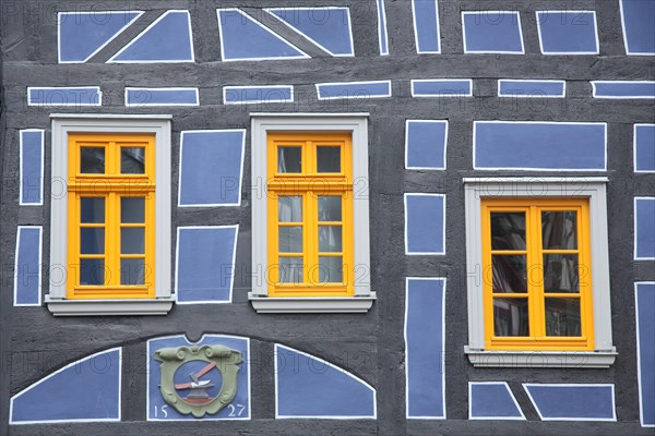 Yellow windows and blue half-timbering on half-timbered house, leaning, detail, blue, yellow, year, 1527, three, house facade, leaning house, Koenig-Adolf-Platz, Idstein, Taunus, Hesse, Germany, Europe