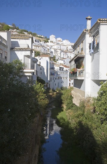 River running past whitewashed houses Setenil de las Bodegas, Cadiz province, Spain, Europe