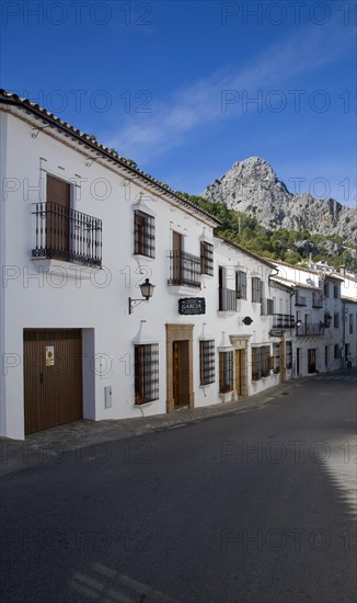 Limestone mountain peaks tower over the Village of Grazalema, Cadiz province, Spain, Europe