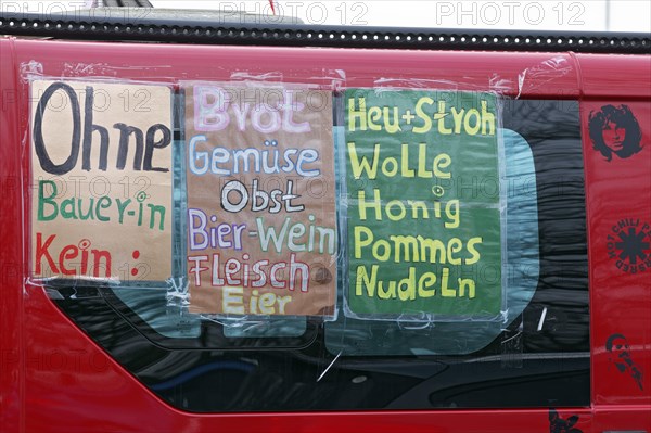 Poster with a list of agricultural products on a vehicle, farmers' protests, demonstration against the policy of the traffic light government, abolition of agricultural diesel subsidies, Duesseldorf, North Rhine-Westphalia, Germany, Europe
