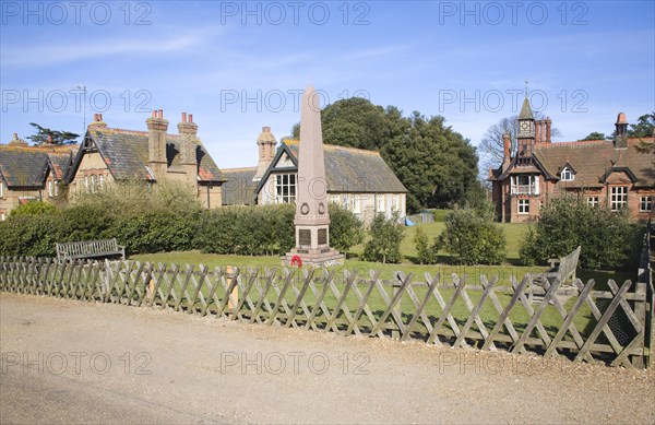 Estate buildings and war memorial in village of Holkham, Norfolk, England, United Kingdom, Europe