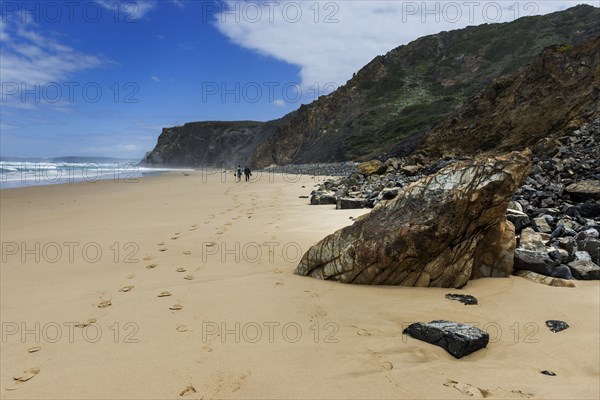 Beach walk in front of rocky beach landscape, walk, tracks, footprints, path, hike, hike, beach, sand, rocks, sea, Atlantic coast, rocky coast, sea, natural landscape, travel, nature, Southern Europe, Carrapateira, Algarve, Portugal, Europe