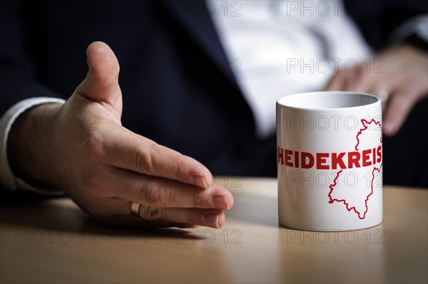 Lars Klingbeil, SPD party leader, gestures next to a cup labelled Heidekreis during an interview in Berlin, 20/02/2024