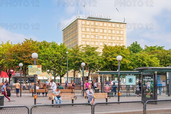 Cityscape view at people waiting at a bus and tram stop in Gothenburg city, Gothenburg, Sweden, Europe
