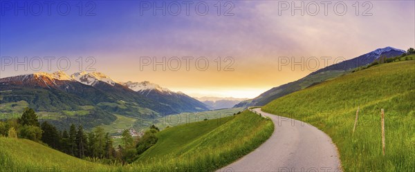 Mountain panorama of a small road in the South Tyrolean Alps, sunset, evening mood, path, Goldrain, Latsch, Vinschgau, South Tyrol, Italy, Europe