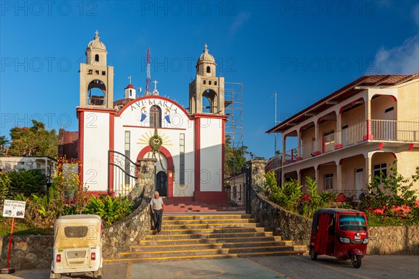 Motorbike taxi in front of the Inglesia Ave Maria church, Pluma Hidalgo, Pochutla, Oxaca state, Sierra Madre del Sur, Mexico, Central America