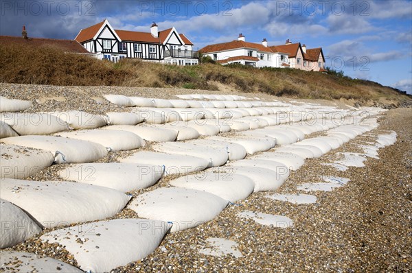Coastal defences normally covered by shingle exposed by winter storms at Thorpeness, Suffolk, England in November 2013