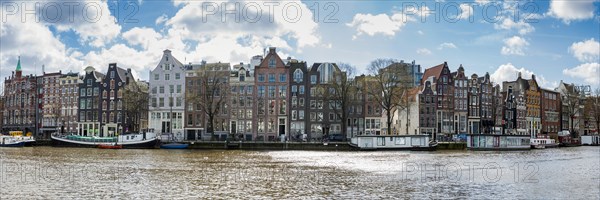 Panorama of the centre, canal houses on the Amstel canal, metropolis, Benelux, skyline, travel, holidays, city trip, city view, overview, row of houses, harbour city, urban, capital, architecture, Amsterdam, Netherlands
