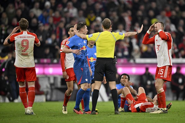 Controversial decision by referee Sascha Stegemann after a tackle, action Lois Openda RasenBallsport Leipzig RBL (17) against Raphael Guerreiro FC Bayern Munich FCB (22) disbelieved, Harry Kane FC Bayern Munich FCB (09) Eric Dier FC Bayern Munich FCB (15) Jamal Musiala FC Bayern Munich FCB (42) Willi Orban RasenBallsport Leipzig RBL (04) Allianz Arena, Munich, Bavaria, Germany FC Bayern Muenchen vs RasenBallsport Leipzig RBL 24.02.2024 DFL REGULATIONS PROHIBIT ANY USE OF PHOTOGRAPHS AS IMAGE SEQUENCES AND/OR QUASI-VIDEO