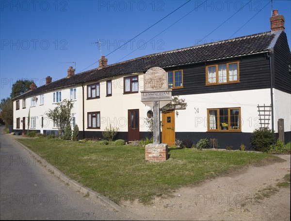 Cottages and village sign at Lessingham, Norfolk, England, United Kingdom, Europe