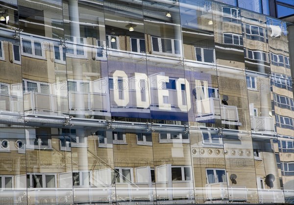 Buildings reflected by glass frontage of the Odeon cinema, Bath, Somerset, England, United Kingdom, Europe