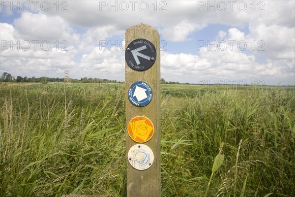 Route markers for Angles Way long distance footpath in marshes near Oulton Broad, Suffolk, England, United Kingdom, Europe