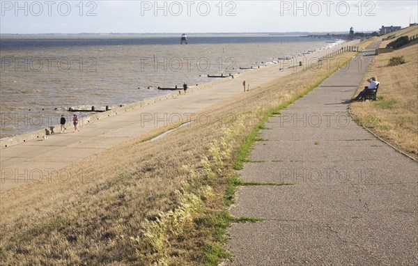People on the seafront promenade at Dovercourt, Harwich, Essex, England, United Kingdom, Europe