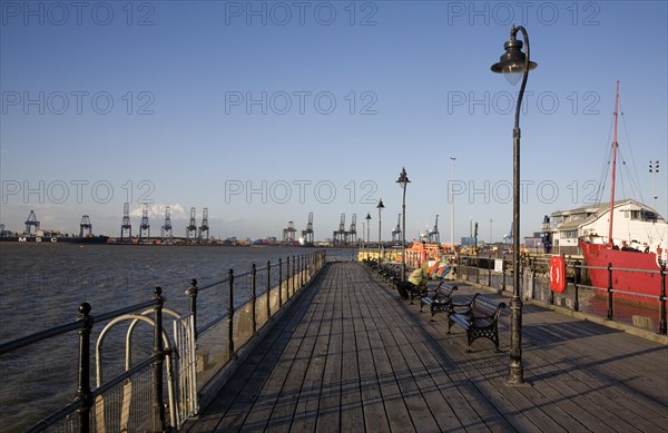 Person enjoying afternoon sunshine Ha'penny pier Harwich, Essex, England, United Kingdom, Europe